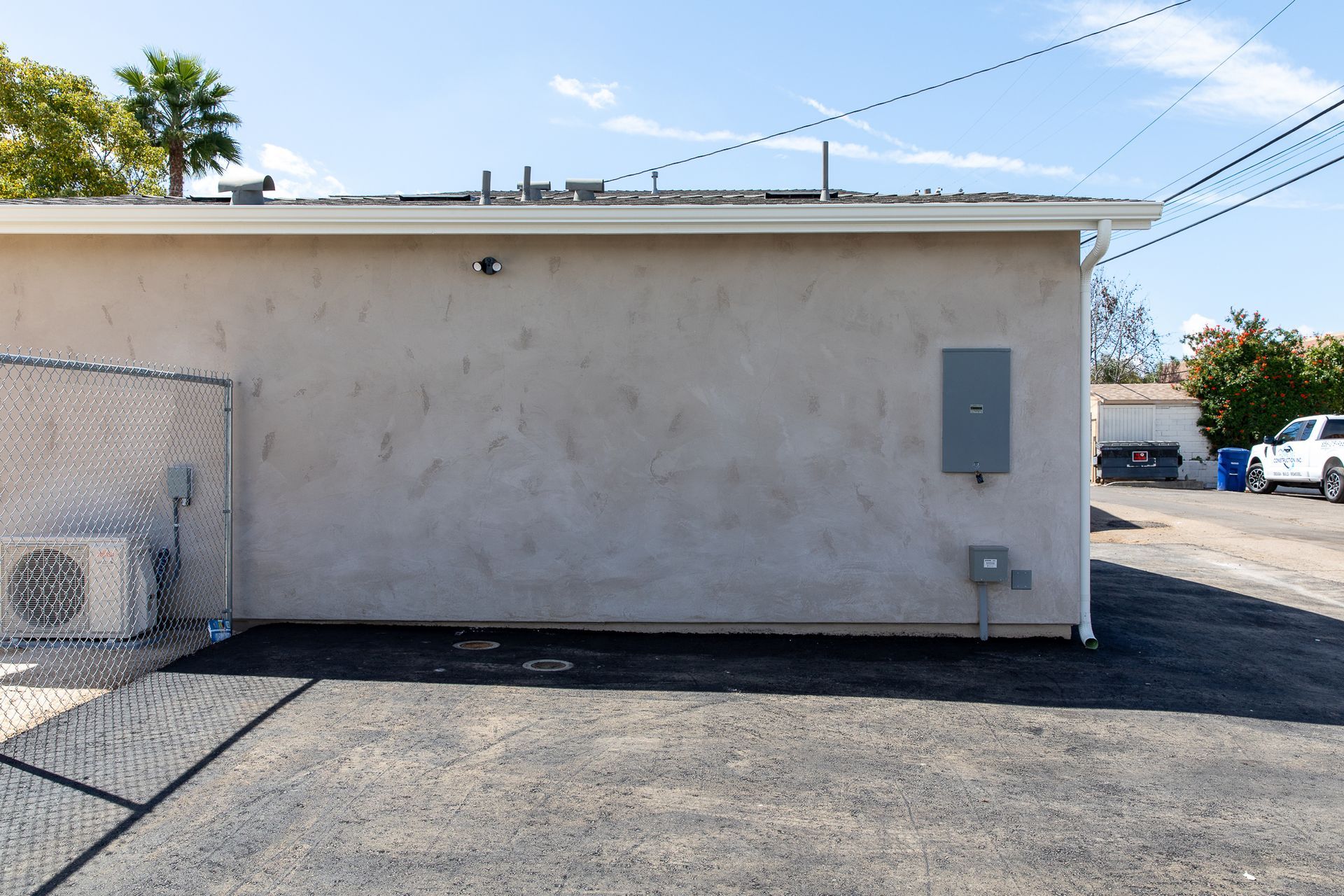 The side of a building with a fence around it