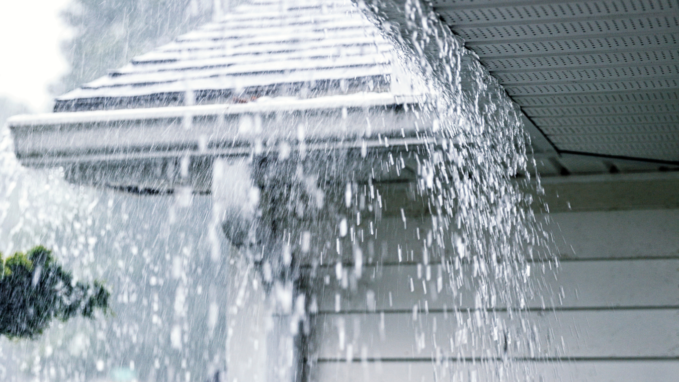 A room with a yellow tile floor and a shelf with toys on it.