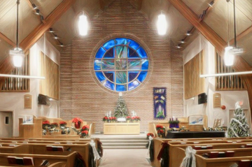 the inside of a church with a stained glass window