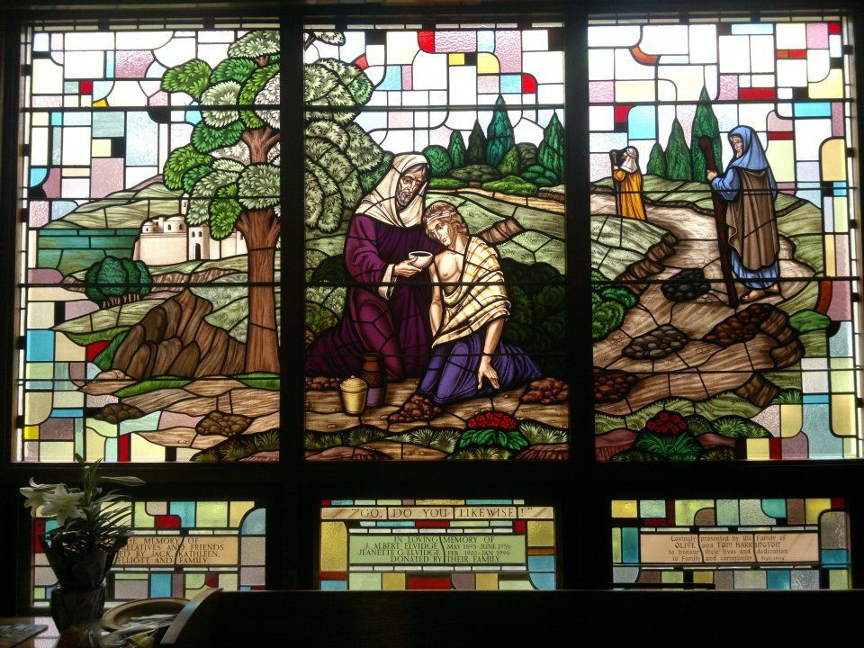 a stained glass window shows a scene from the bible