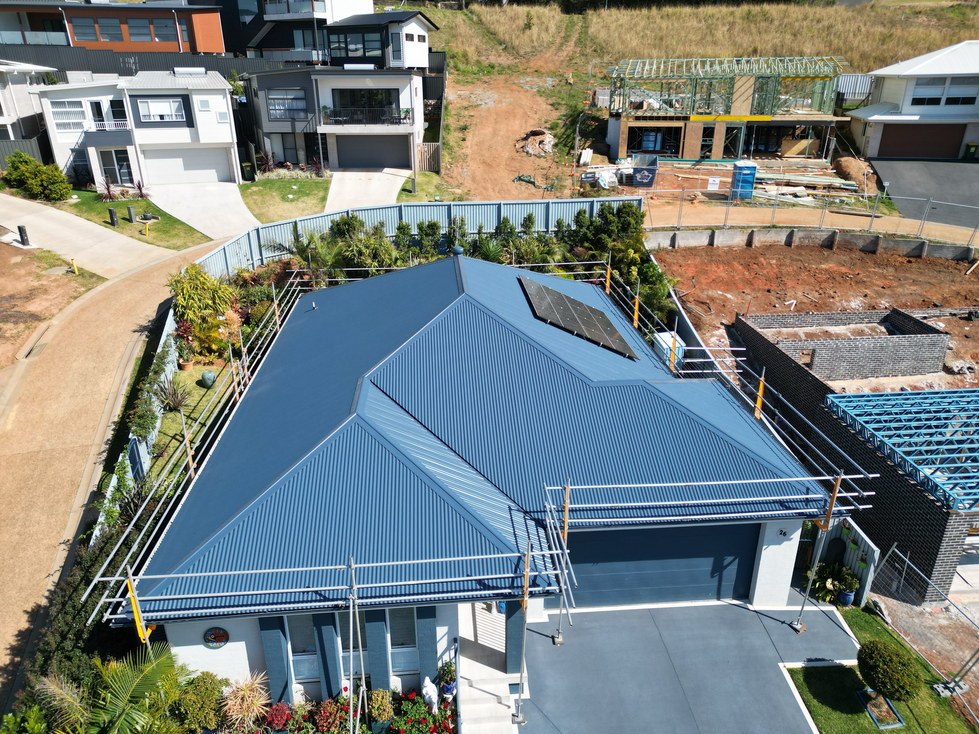 A Close Up Of A Roof With A Blue Sky In The Background — Bulley Roof Restoration, Painting & Pressure Cleaning in Wingham, NSW