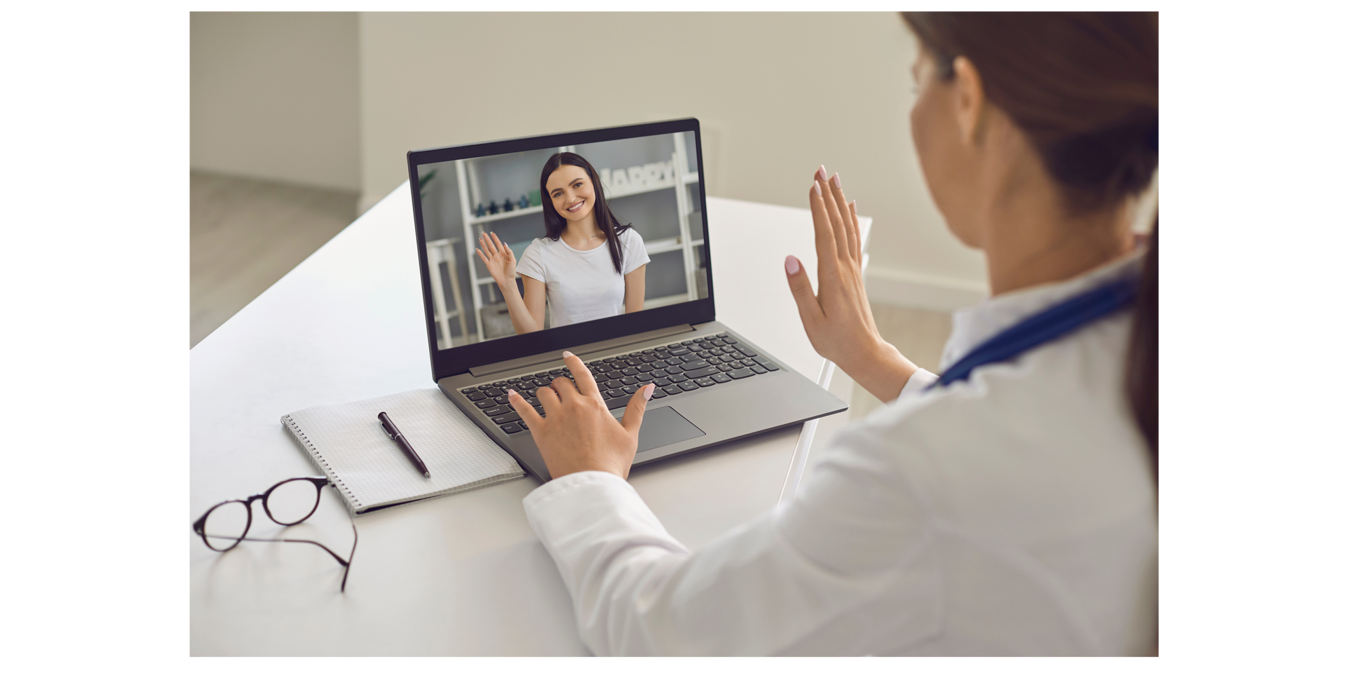 Doctor having a video call with a patient on a laptop.