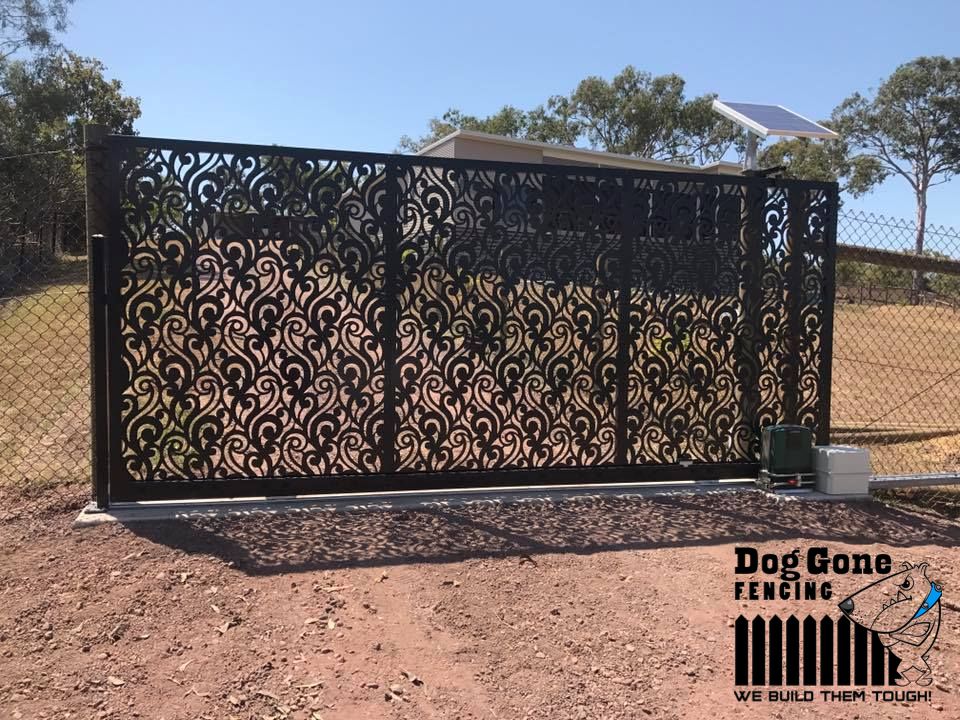 A Black Gate With A Pattern On It — Dog Gone Fencing in Paget, QLD