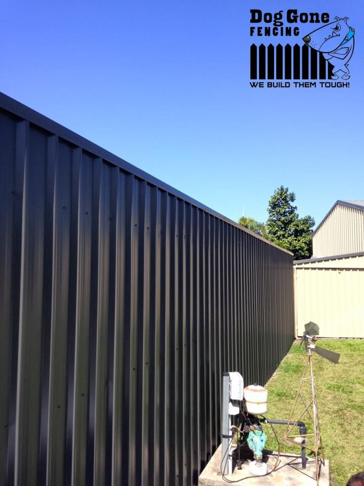 A Black Colorbond Fence — Dog Gone Fencing in Paget, QLD