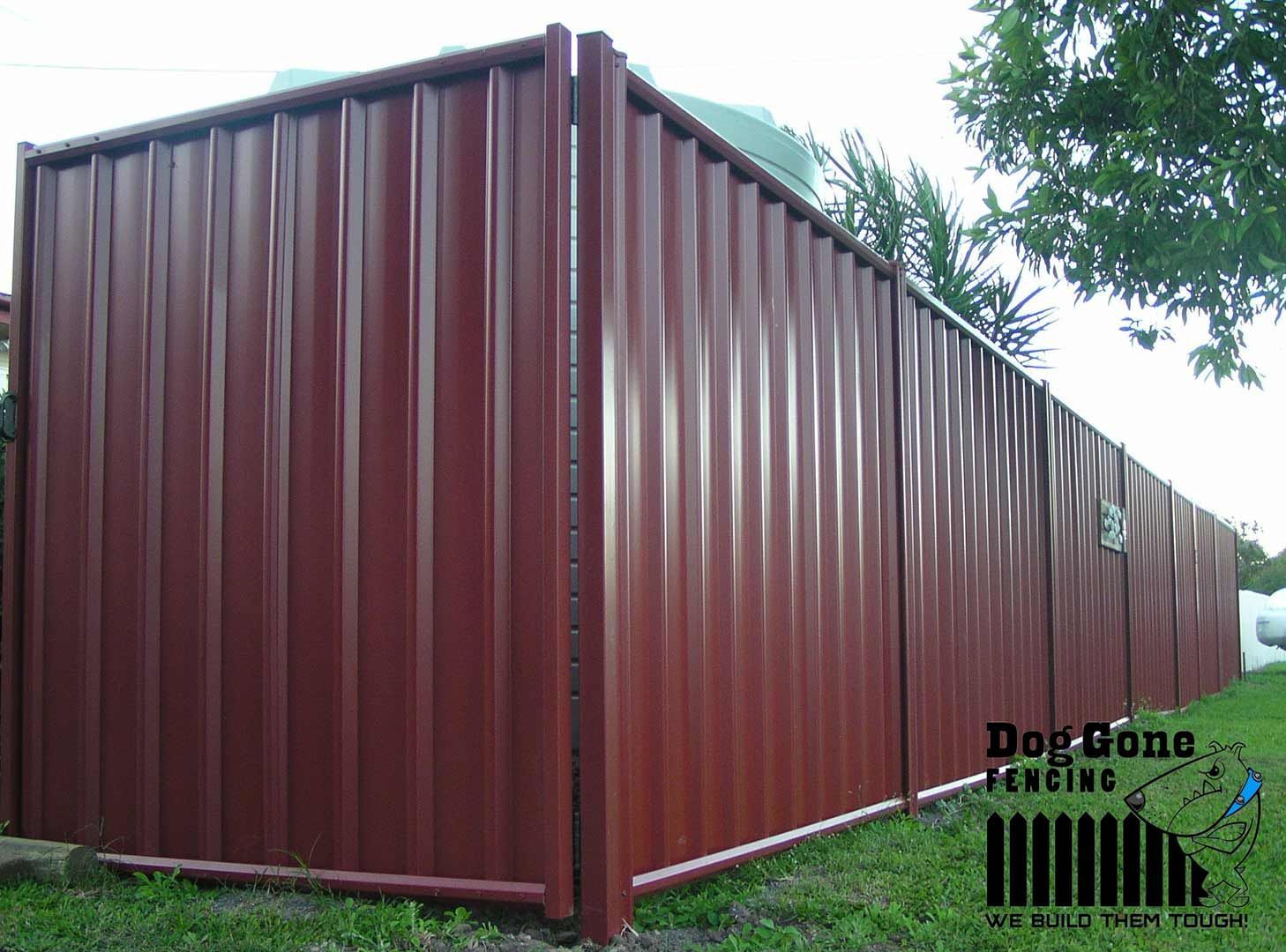 A Red Coloured Colorbond Fence — Dog Gone Fencing in Paget, QLD