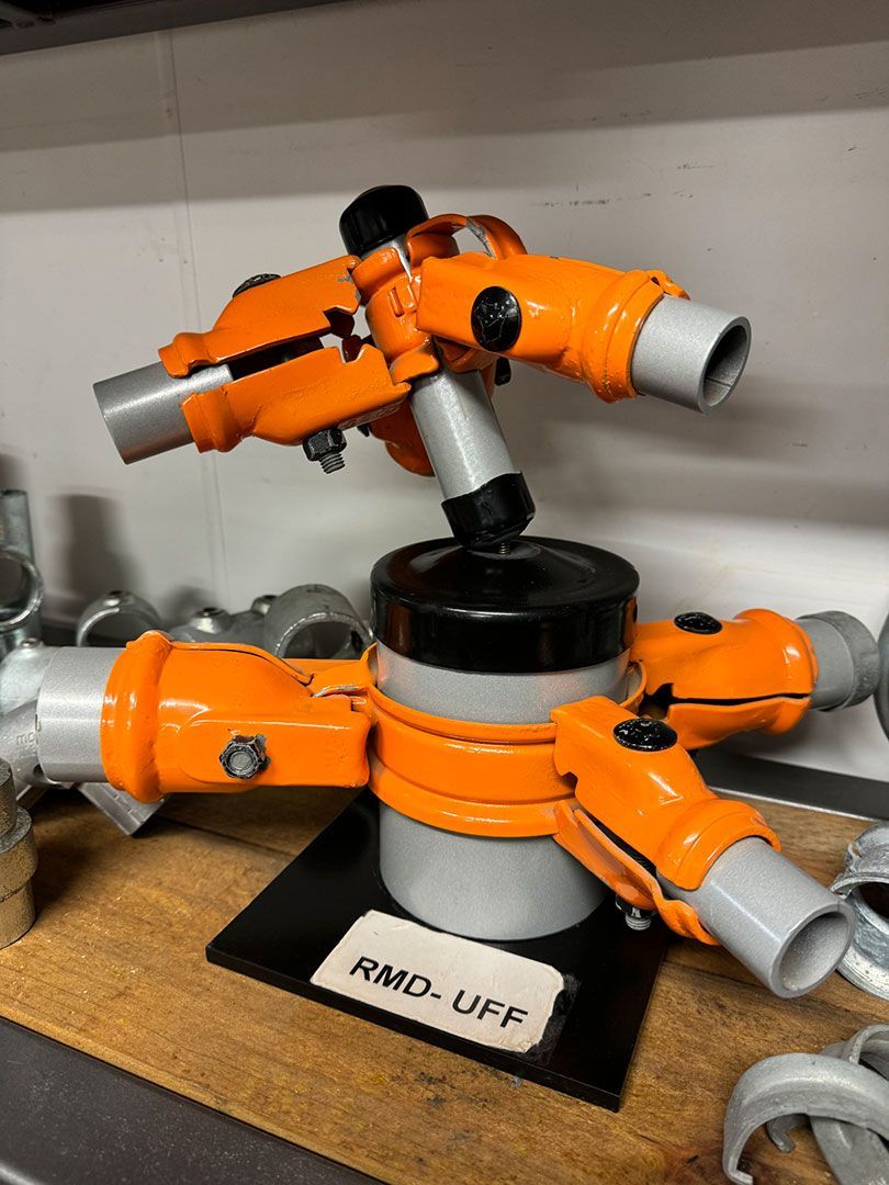 Pieces Of Tube Steel Holding By A Fencing Support Tool — Dog Gone Fencing in Paget, QLD
