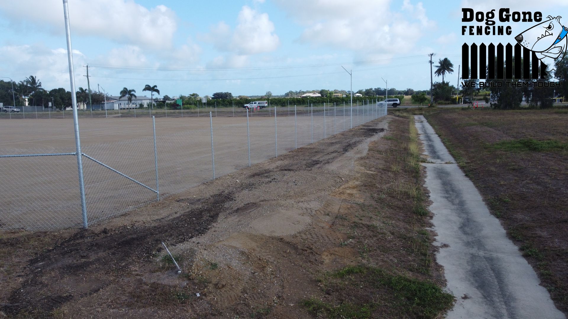 A Fenced Dirt Road Area  — Dog Gone Fencing in Paget, QLD