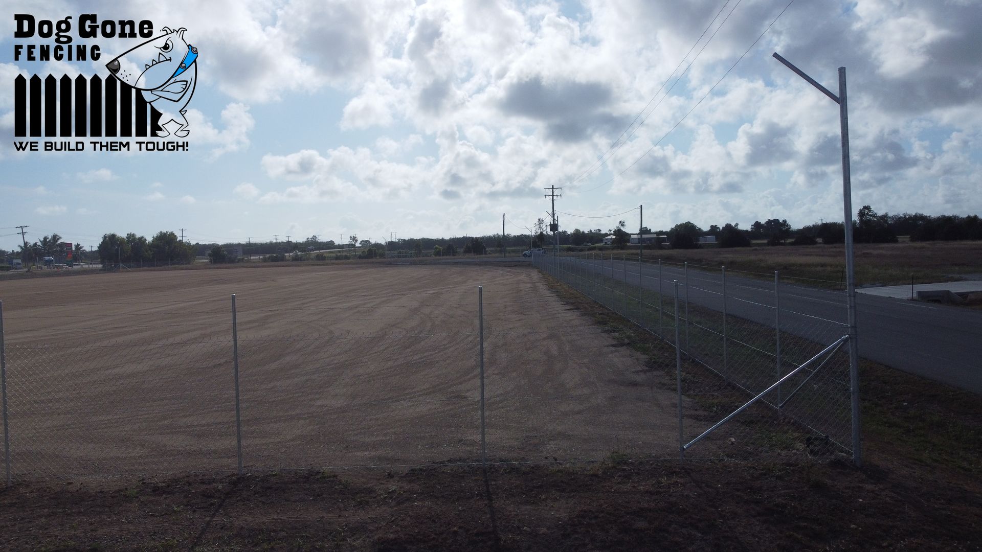 A Fence Company Called Dog Gone Fencing Has A Large Field In The Background  — Dog Gone Fencing in Paget, QLD