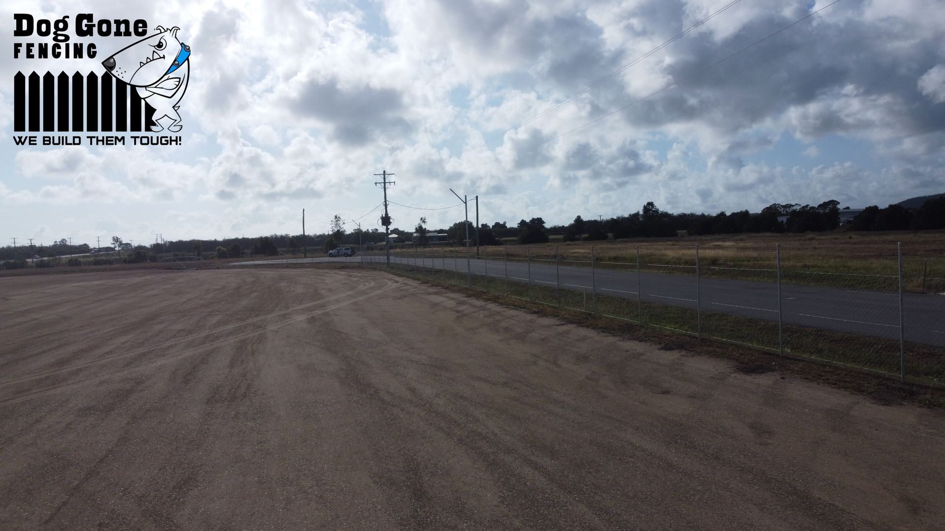 A Dirt Road With Chain Fencing  — Dog Gone Fencing in Paget, QLD