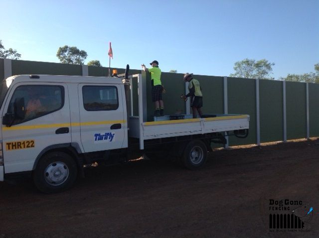 A White Truck With The Number Thr122 On It — Dog Gone Fencing in Paget, QLD