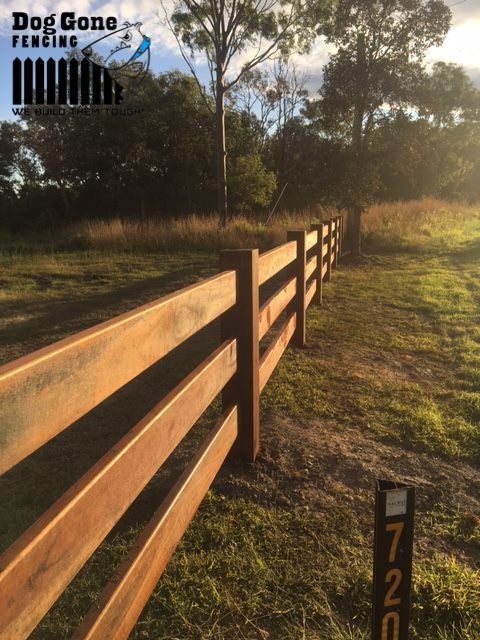 A Wooden Fence With The Words Dog Gone Fencing On It — Dog Gone Fencing in Paget, QLD