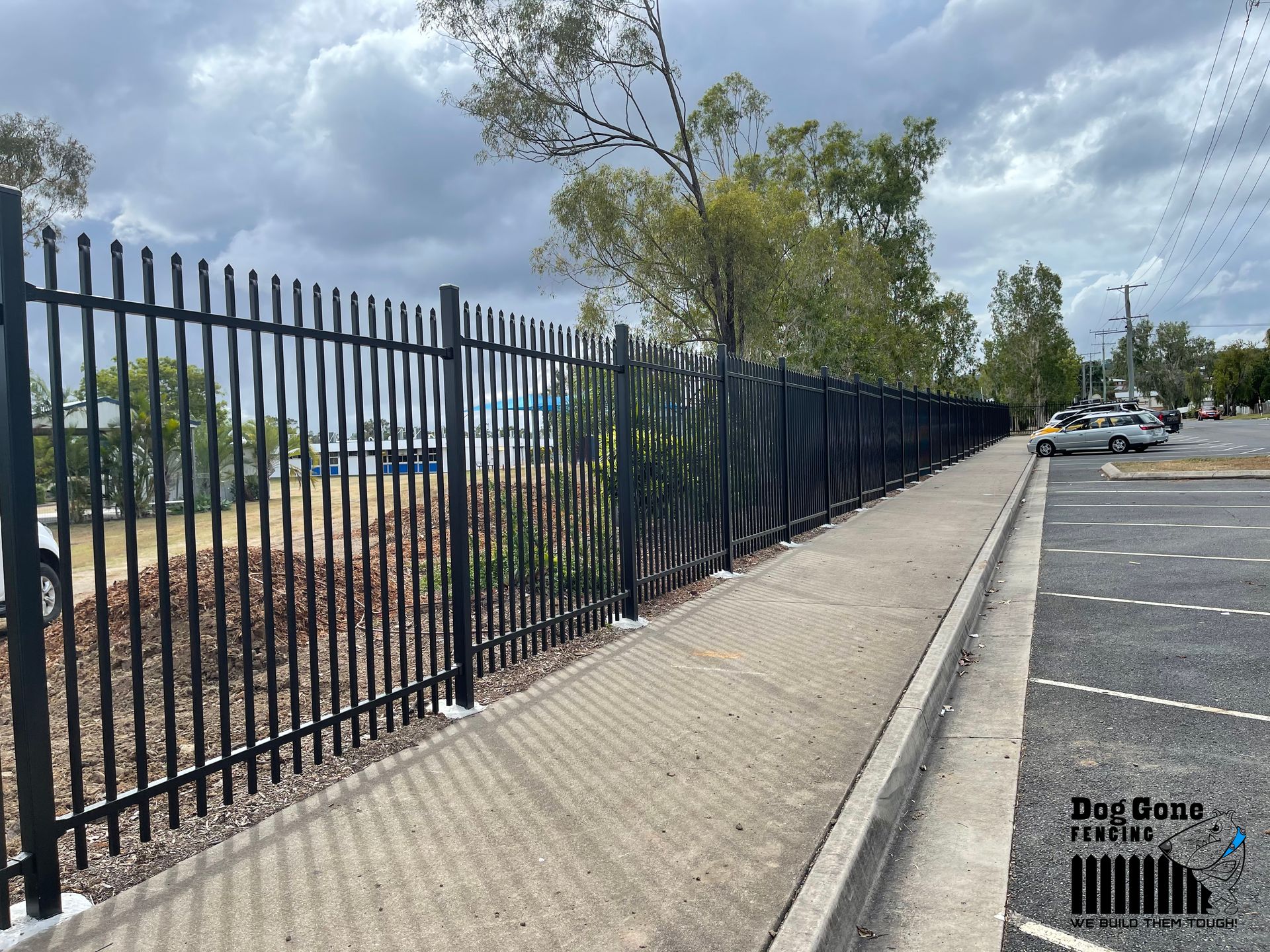 Black Fencing Beside the Sidewalk — Dog Gone Fencing in Paget, QLD