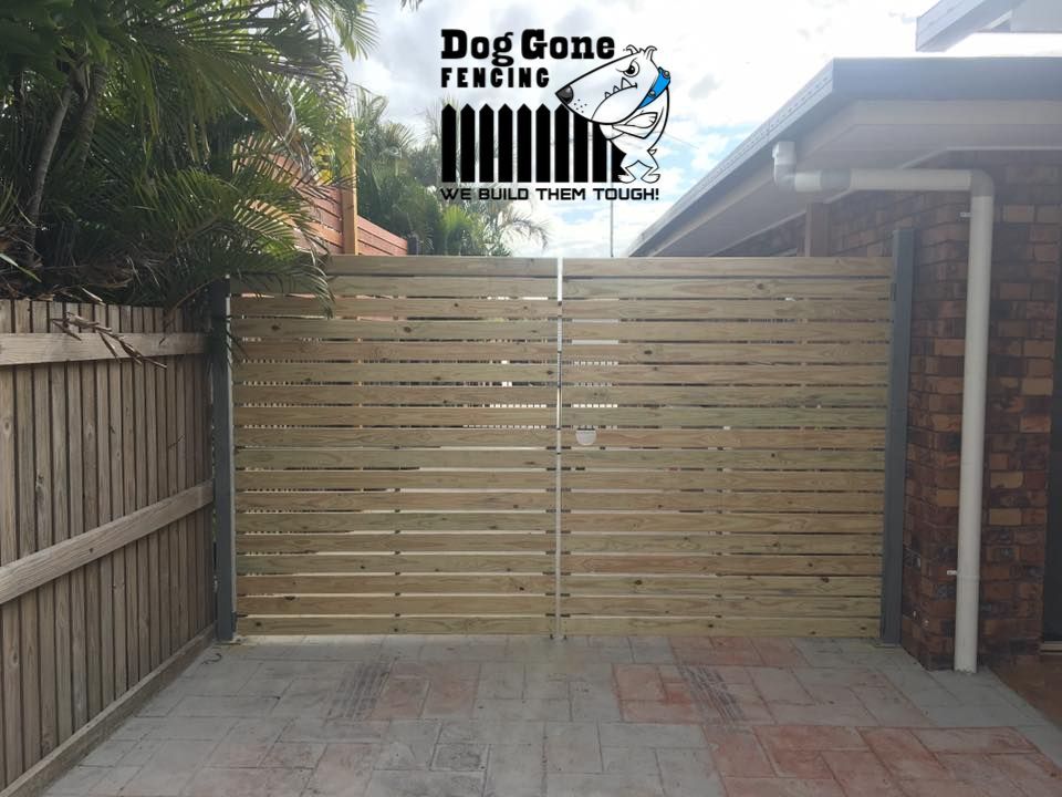 A Wooden Fence With The Words Dog Gone Fencing On It — Dog Gone Fencing in Paget, QLD