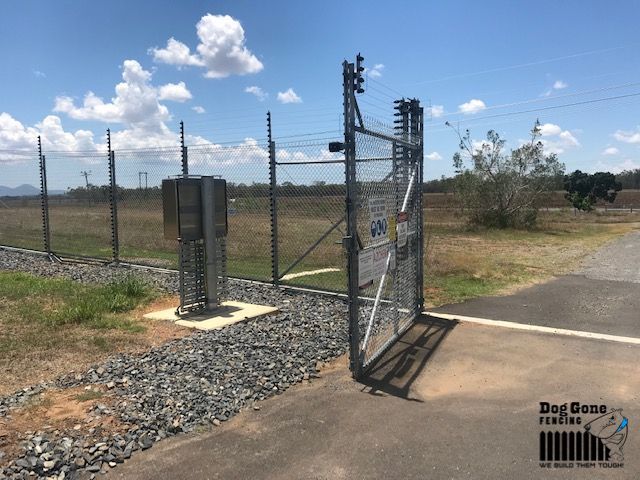 A Fence With A Gate Open And A Box In The Background  — Dog Gone Fencing in Paget, QLD