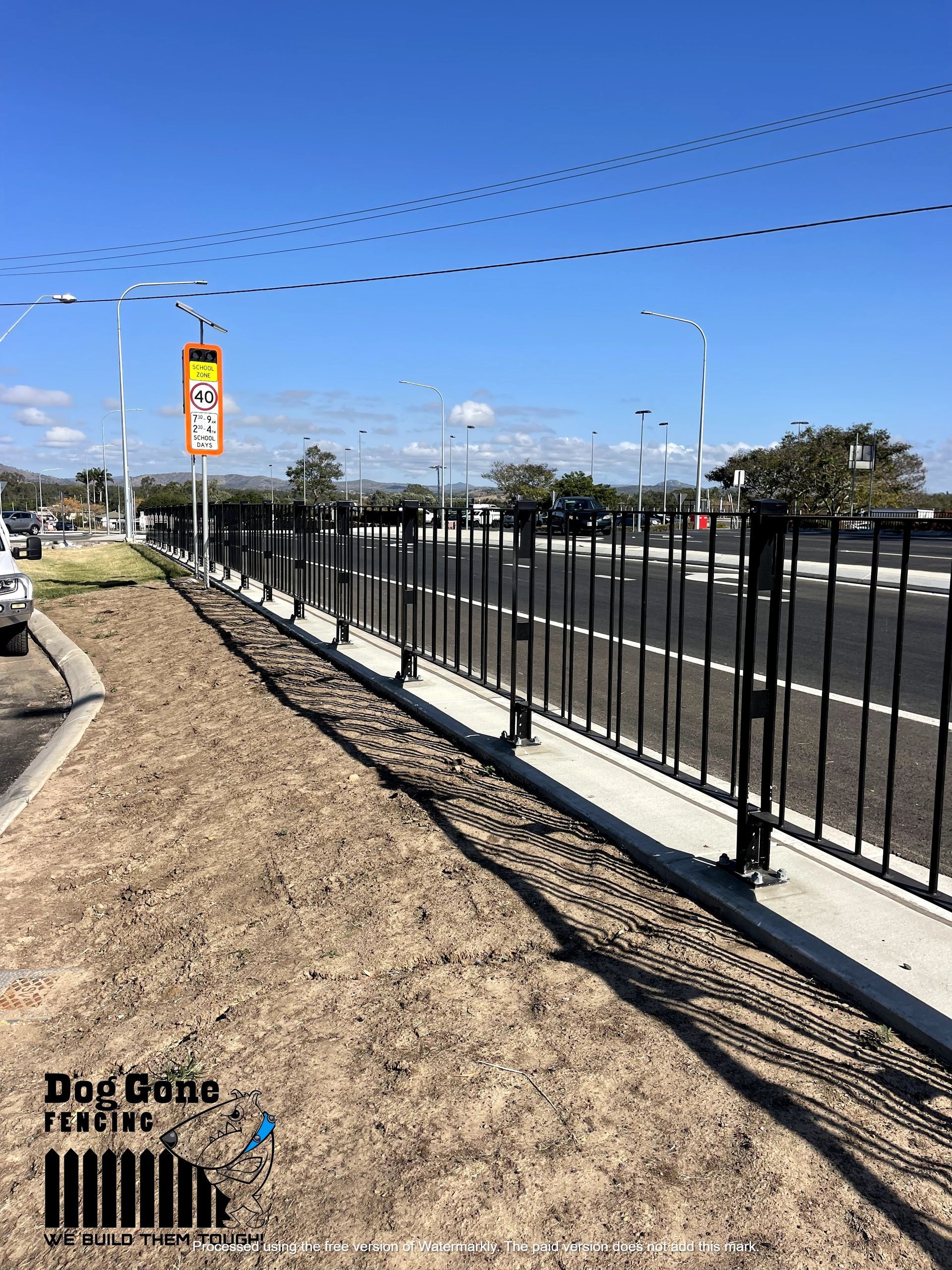 A Wrought Iron Fence Along The Side Of A Road — Dog Gone Fencing in Paget, QLD