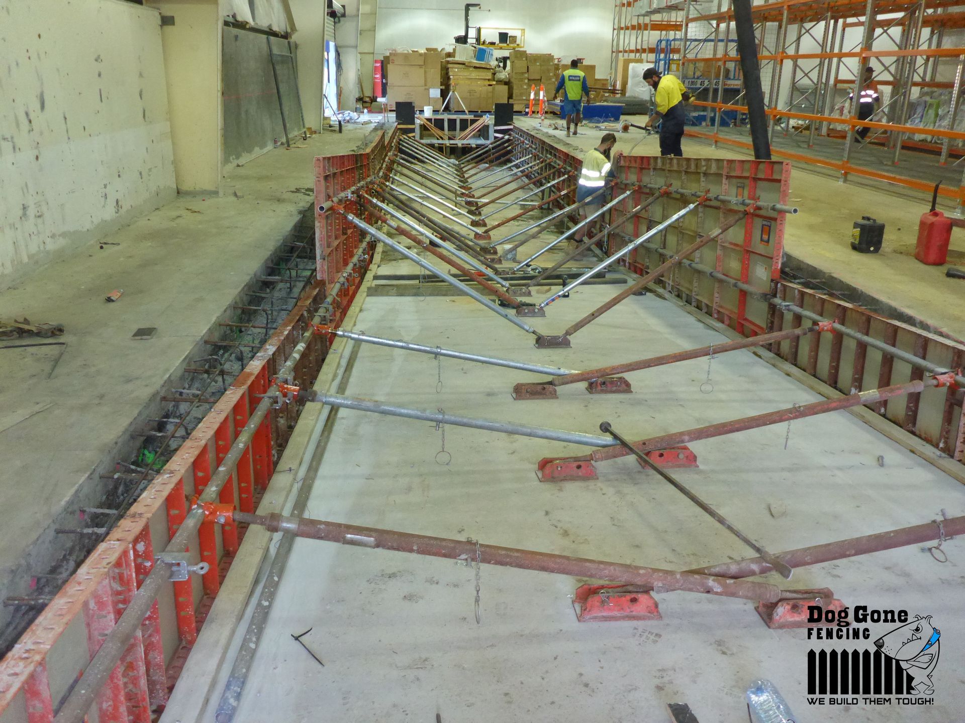 A Large Concrete Structure Is Being Built In A Warehouse — Dog Gone Fencing in Paget, QLD