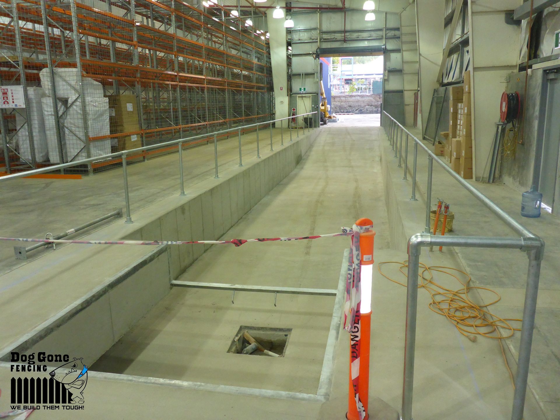 A Warehouse With A Drain In The Middle Of It — Dog Gone Fencing in Paget, QLD