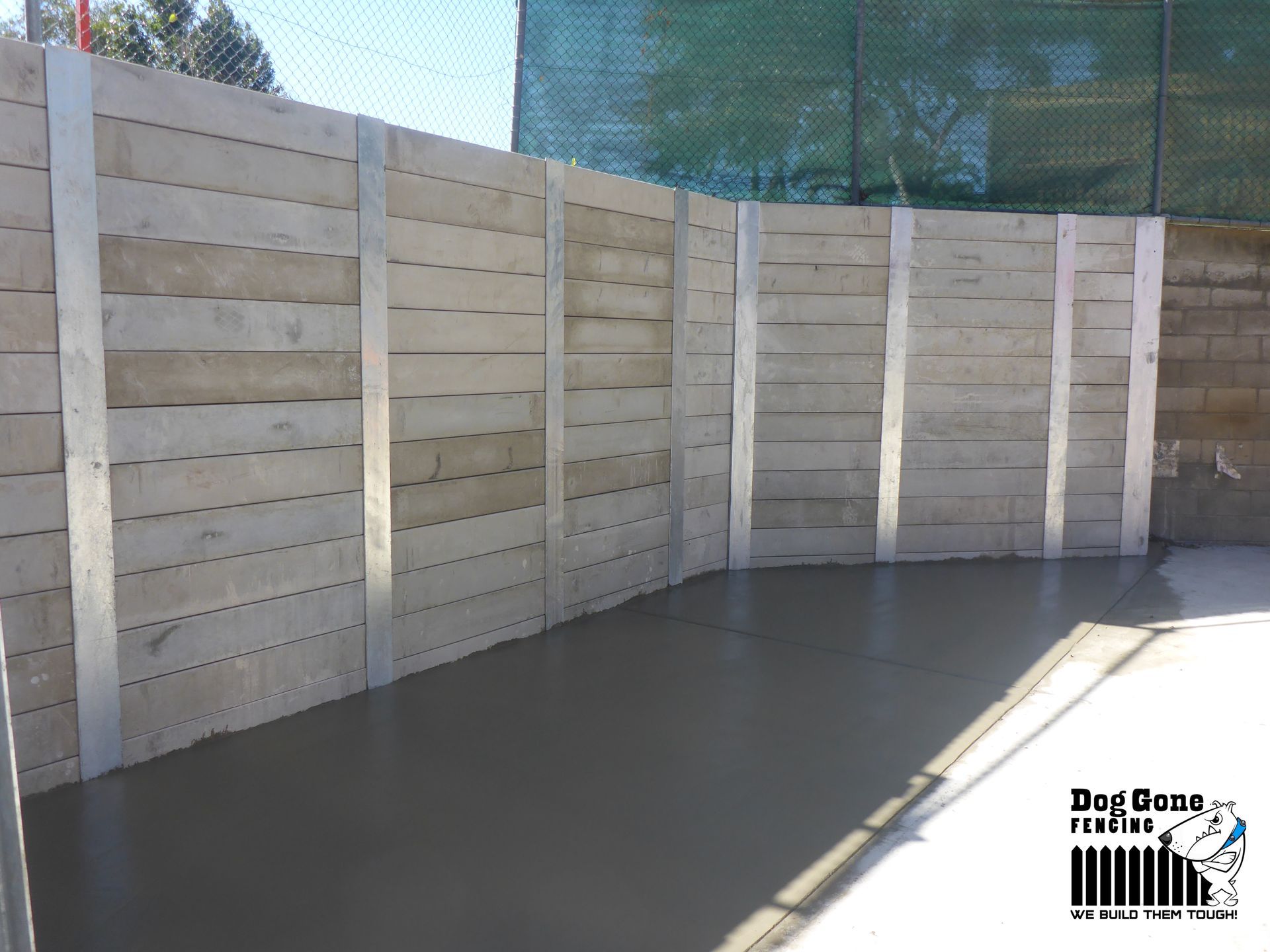 A Picture Of A Wooden Wall With The Words Dog Gene Realtors On The Bottom — Dog Gone Fencing in Paget, QLD