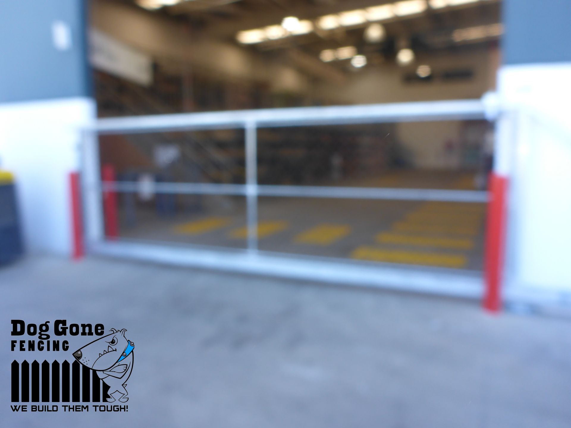A Blurred Image Of A Sliding Gate With The Words Top Gone Welding On The Bottom — Dog Gone Fencing in Paget, QLD
