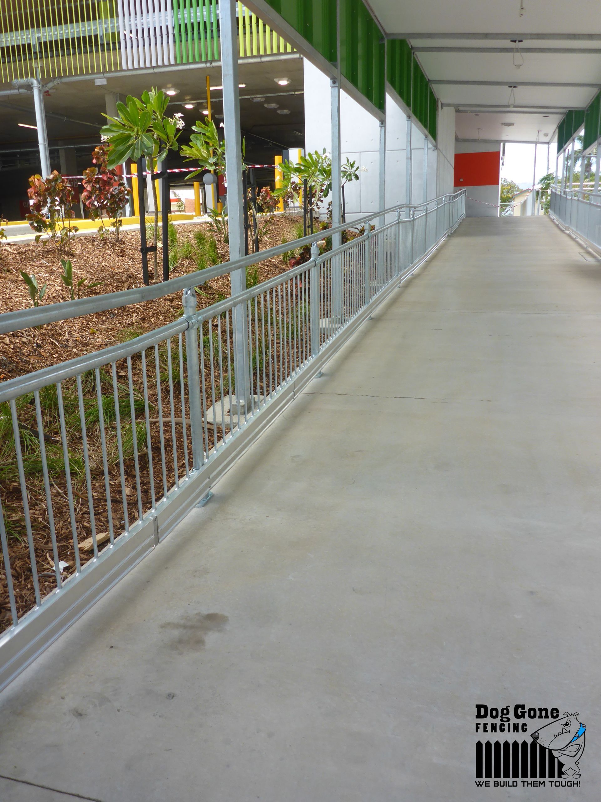 A Walkway With A Fence And A Sign That Says Precision Fences — Dog Gone Fencing in Paget, QLD