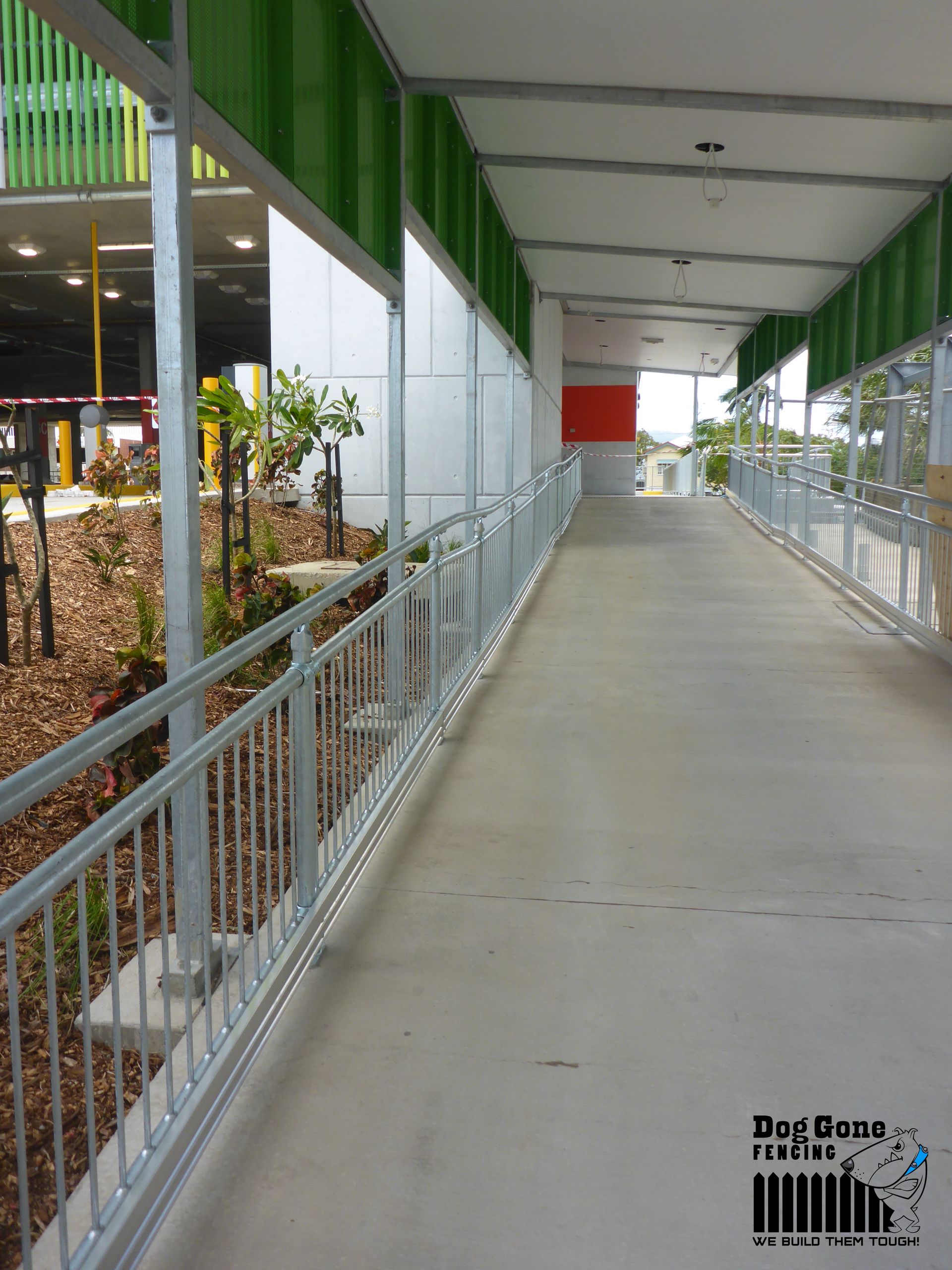 A Walkway With A Railing And A Sign That Says Precision Fences — Dog Gone Fencing in Paget, QLD