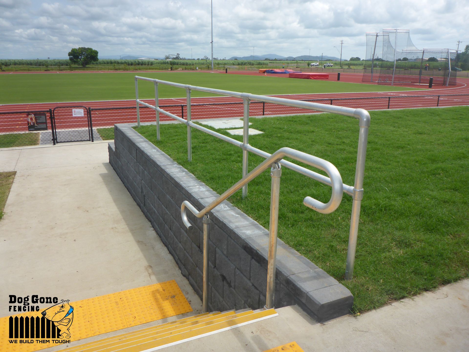 Stairs Leading Up To A Track With A Metal Railing — Fencing in Mackay, QLD