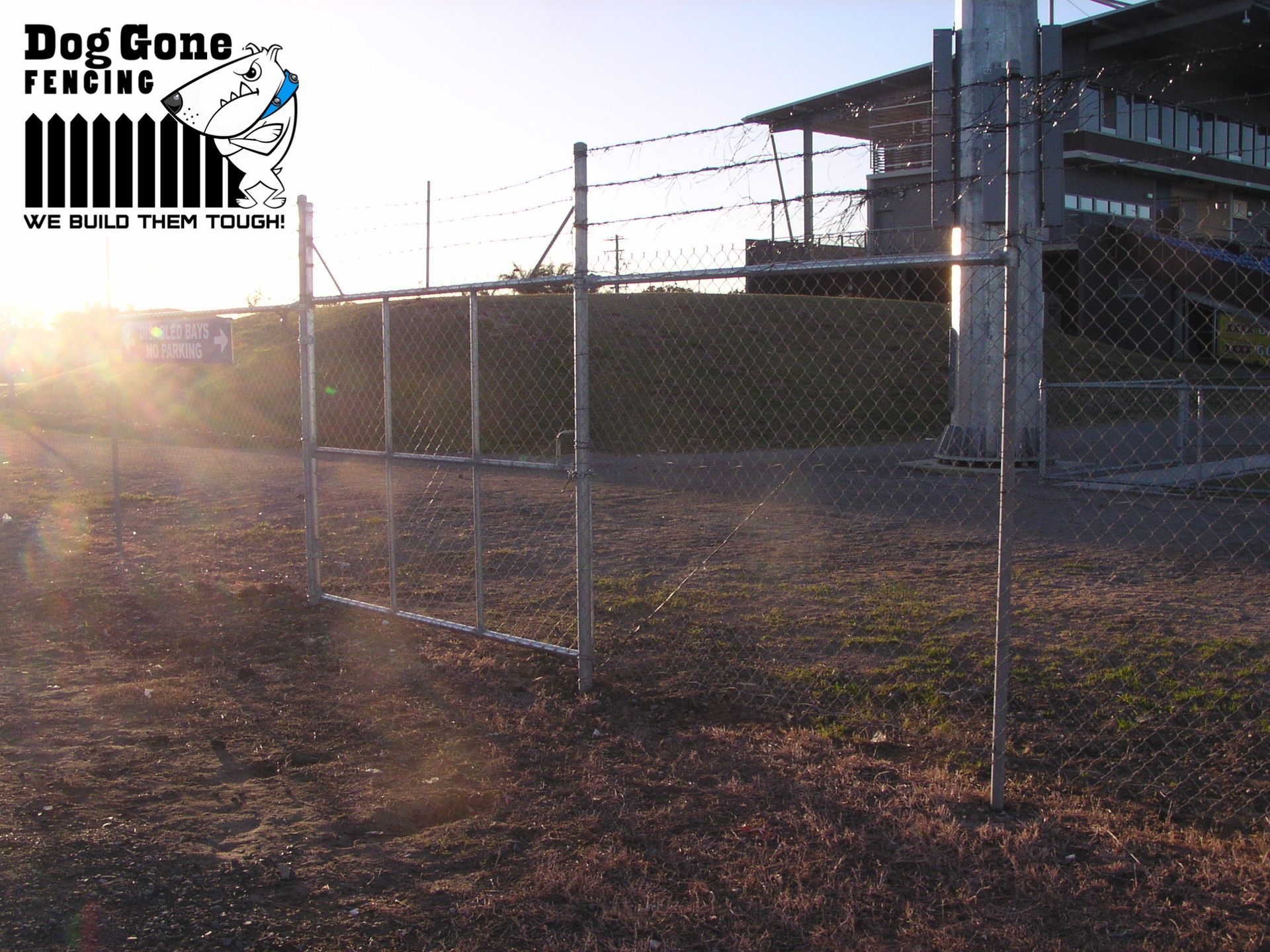 A Chain Link Fence Surrounding A Property  — Dog Gone Fencing in Paget, QLD