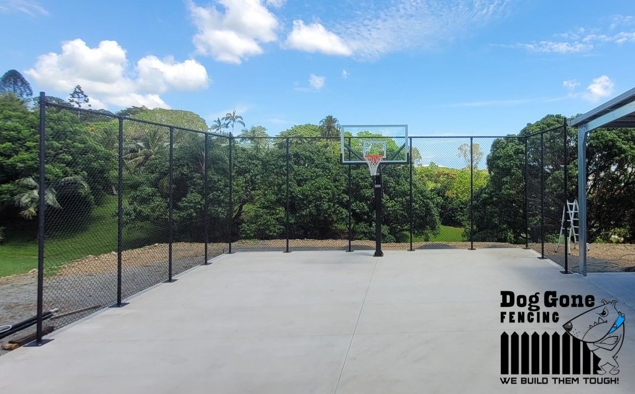 A Basketball Court With A Basketball Hoop In The Middle Of It — Dog Gone Fencing in Paget, QLD