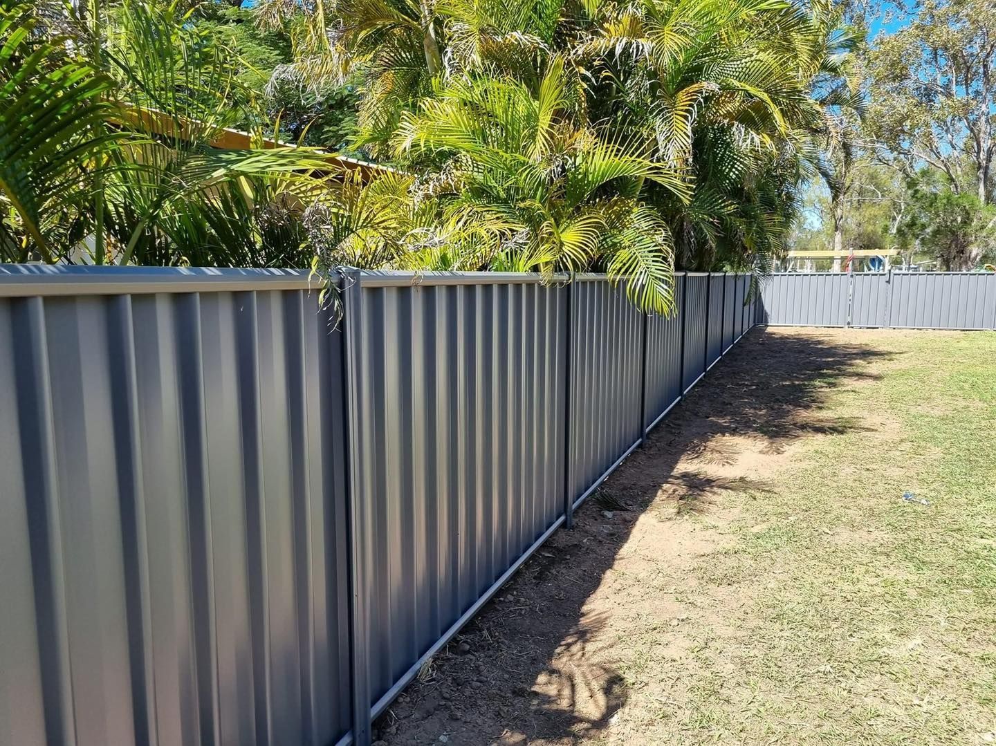 Sturdy Black colorbond Fence For Secure Enclosures — Dog Gone Fencing in Paget, QLD