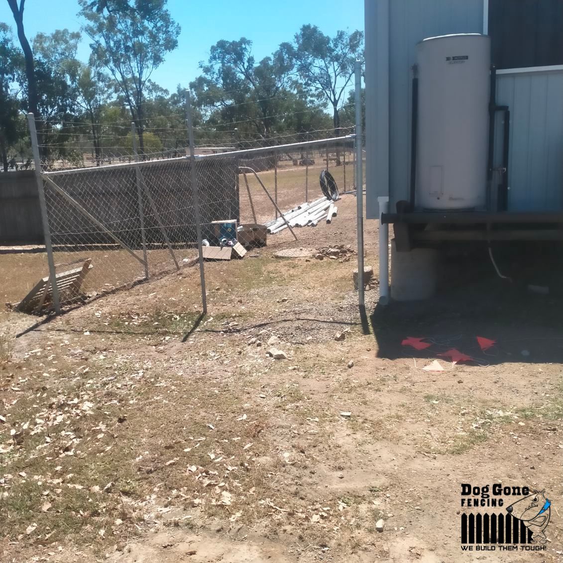 A Fenced In Area With A Water Heater And A Fenced In Area — Dog Gone Fencing in Paget, QLD