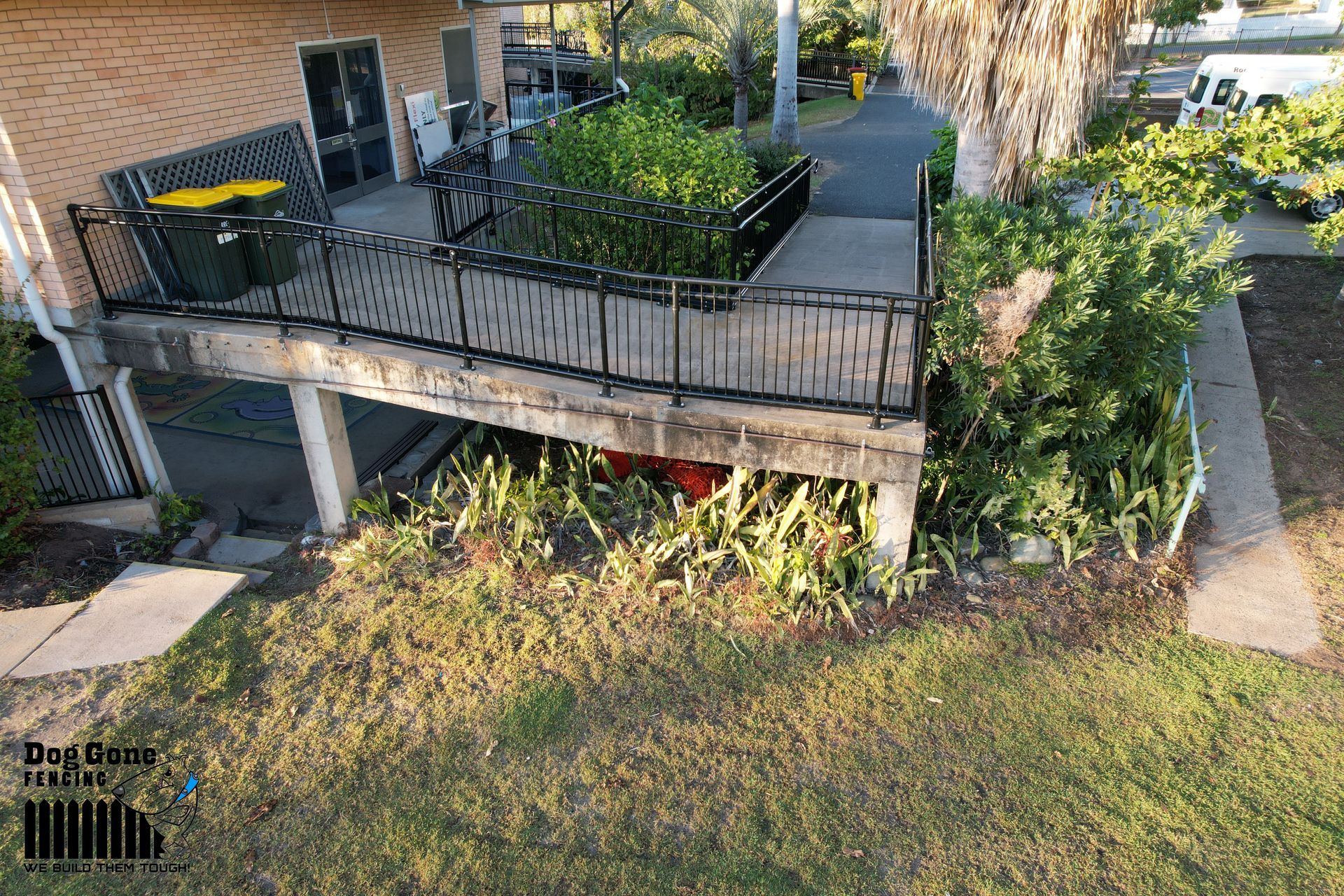 An Aerial View Of A House With A Balcony And A Car Parked Underneath It - Fencing in Mackay, QLD