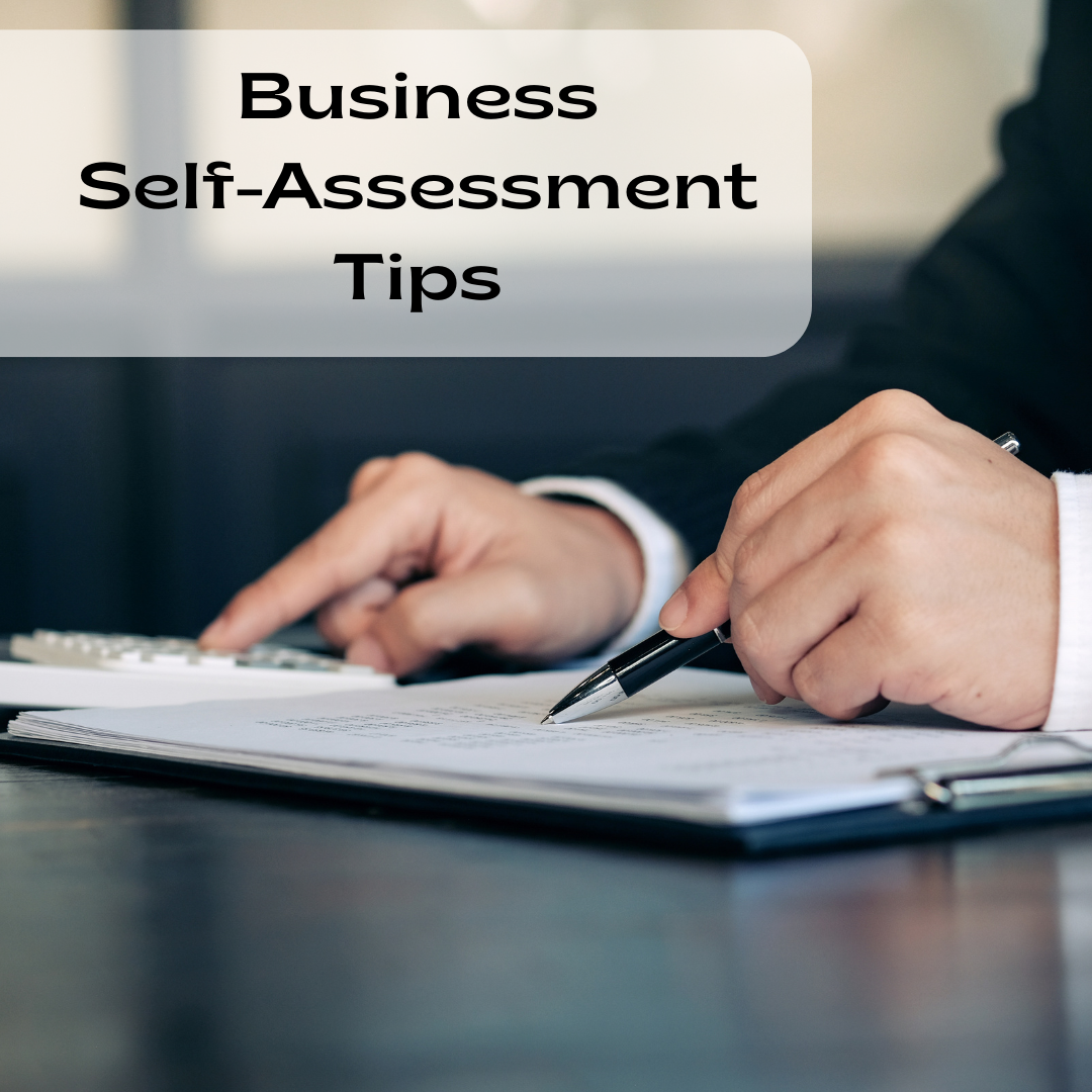 Person in suit reviews documents with pen; 