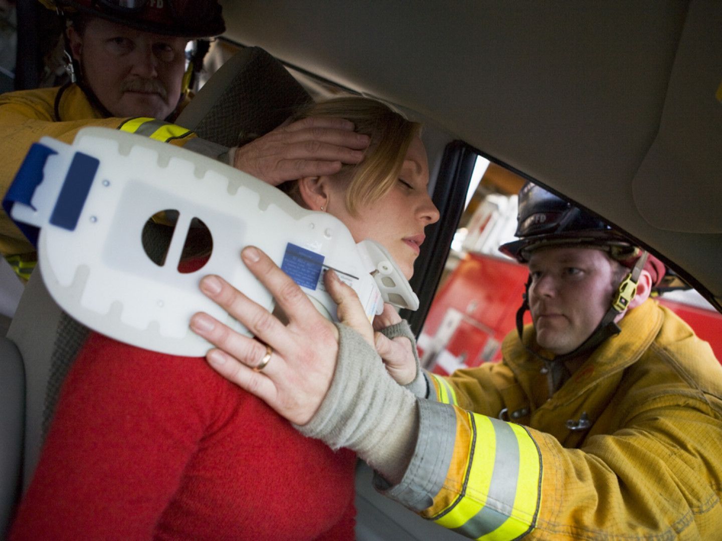Firefighters Saving an Injured Woman in Car