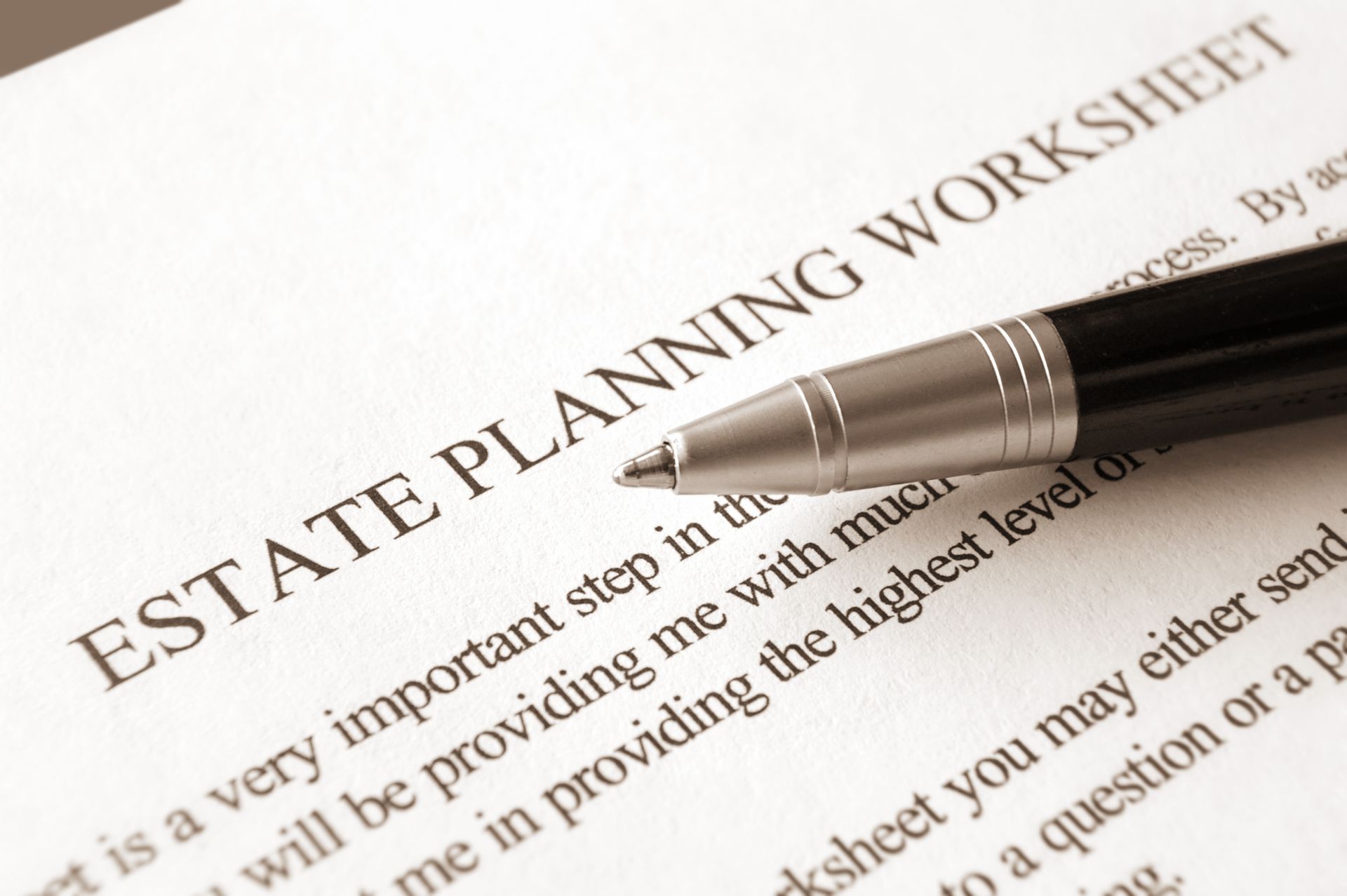 Close-up of an estate planning worksheet with a pen on top of it.