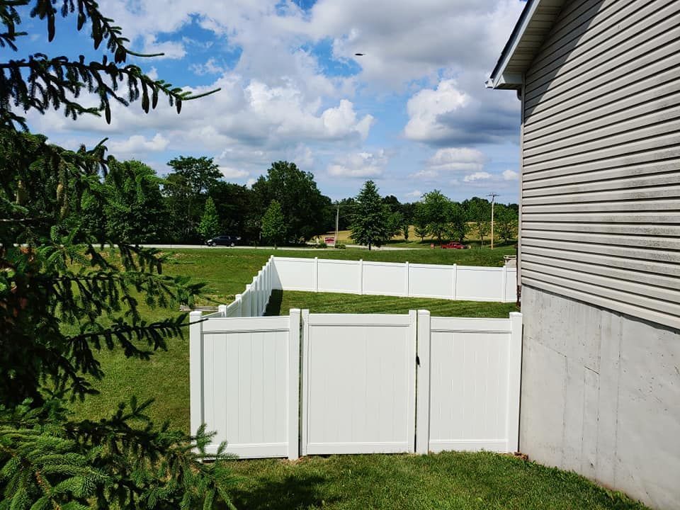 White Fence & House — O’Fallon, MO — America’s Fence & Deck Company