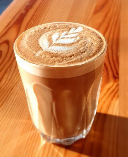 A Close Up of a Cup of Coffee on a Wooden Table — Coffee on High in Wauchope, NSW