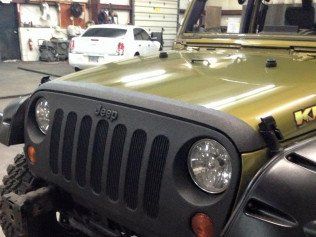Close up of Front of Green Jeep