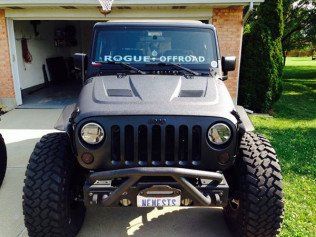 Empty bed of a modern pickup truck, rough surface, soft focus image