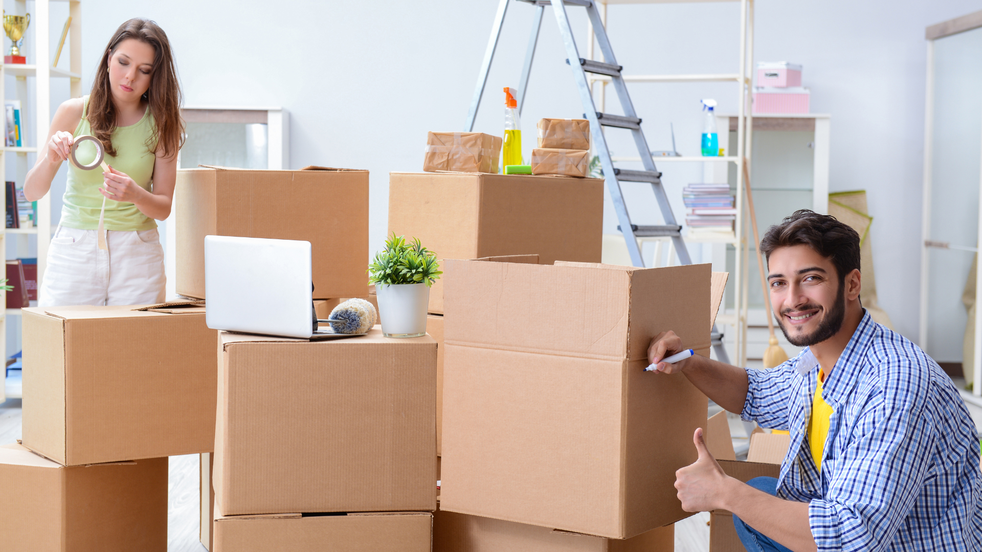 A man and a woman are moving into a new home.