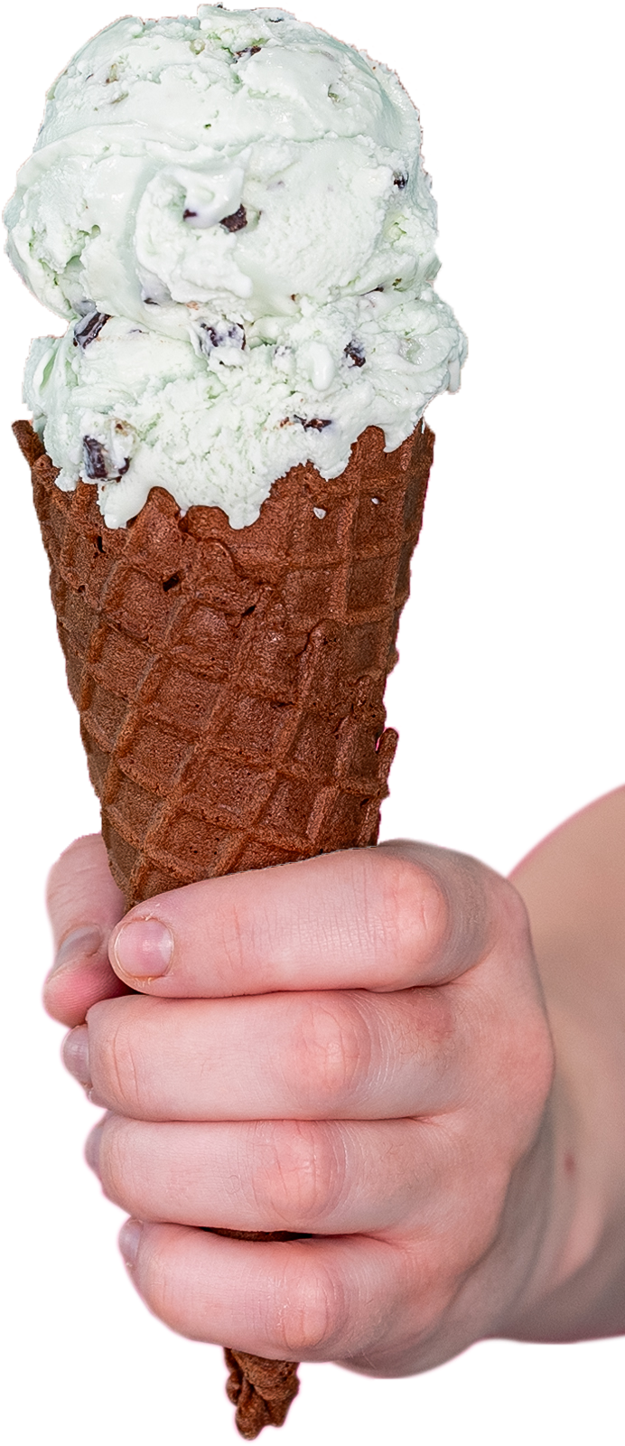 A person is holding an ice cream cone in their hand.