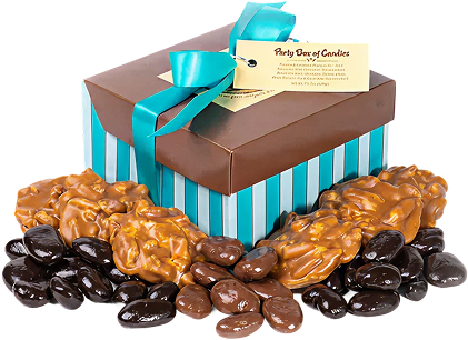 A brown and blue striped box filled with chocolate covered nuts.