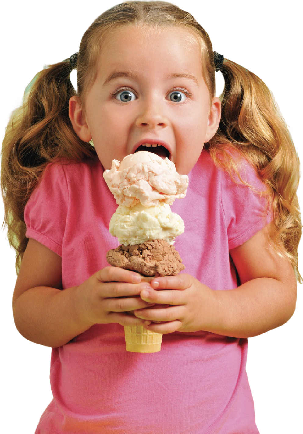A little girl in a pink shirt is eating an ice cream cone