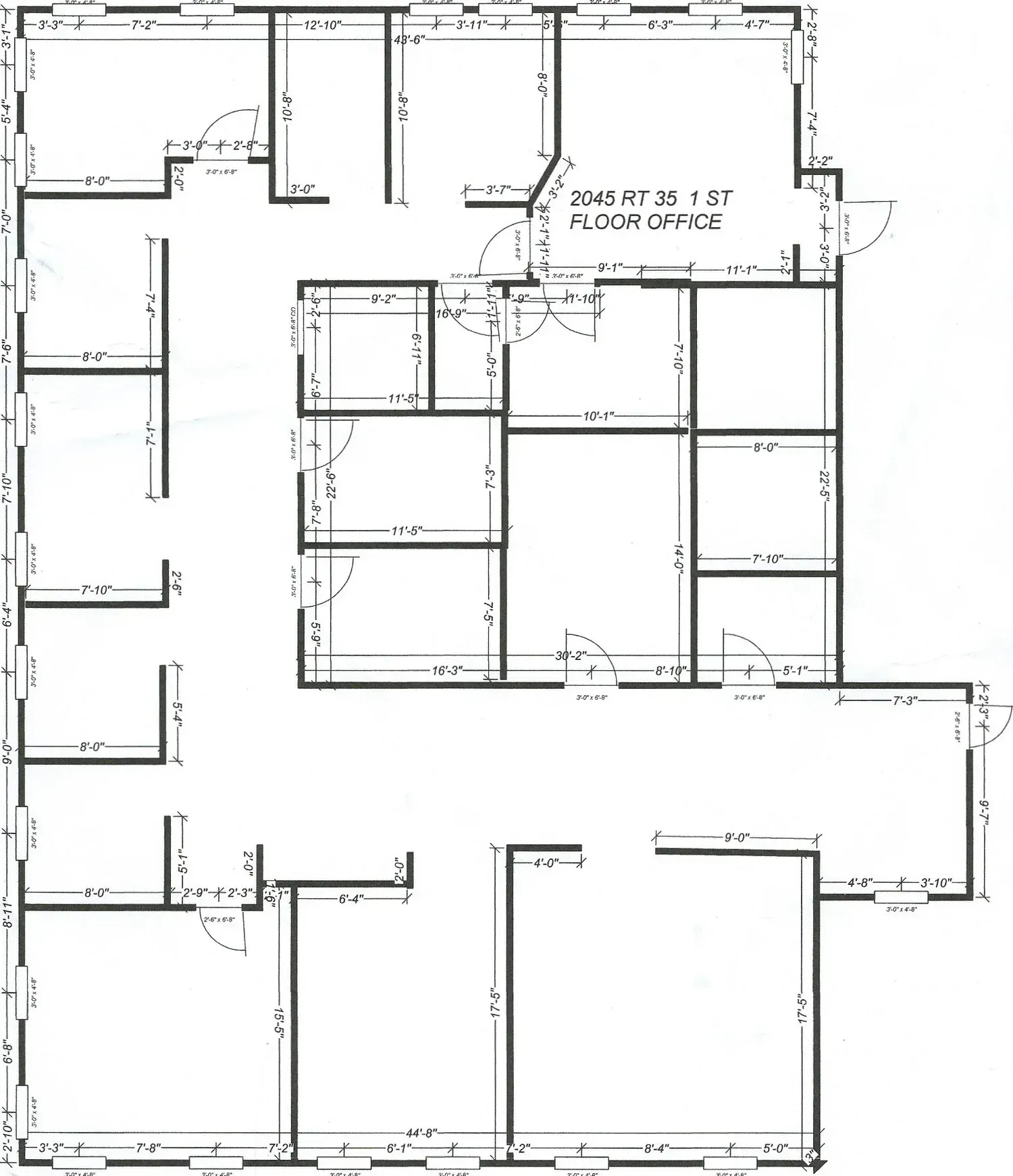 Floor plan of an office building with multiple rooms and doorways.