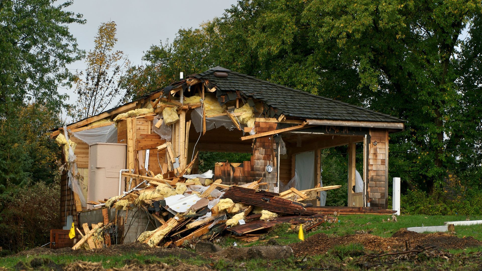 Storm damaged or hurricane damaged house on the woods.