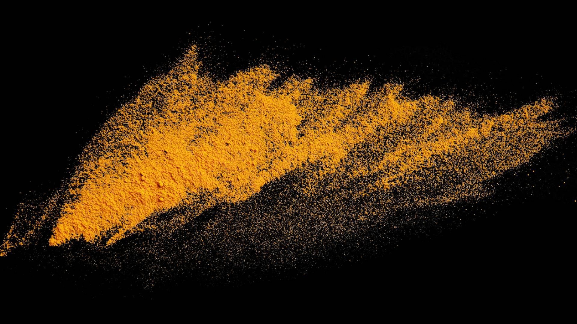 A splash of red-orange powder against a black background near Tollesboro, Kentucky (KY)