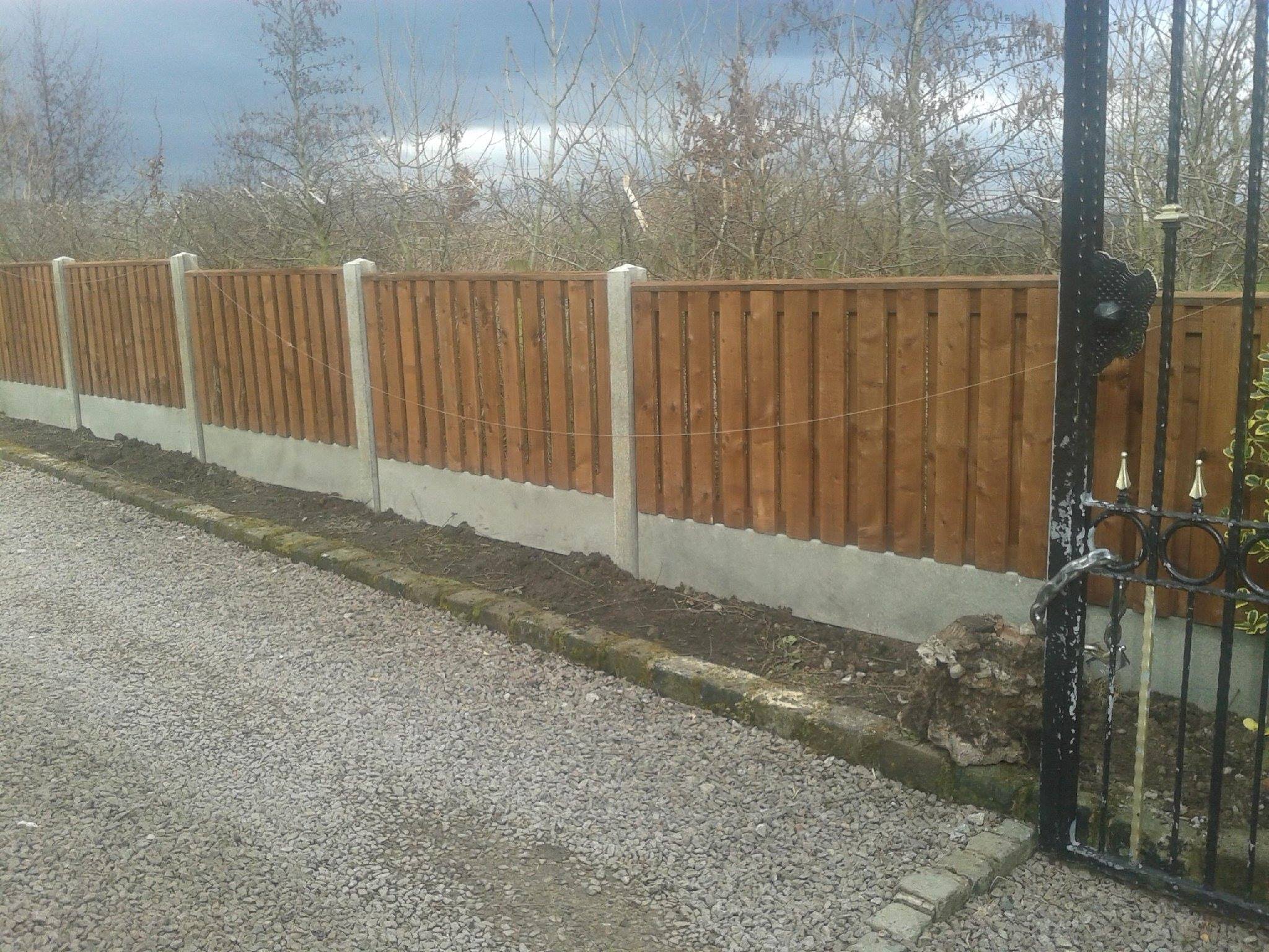 woden fence mounted on cement
