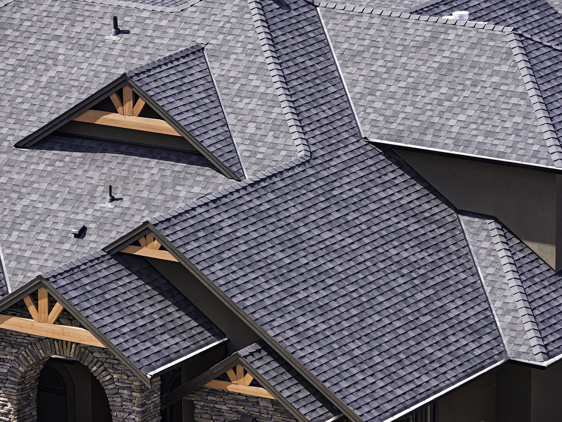 Rooftop in a newly constructed subdivision in Kelowna British Columbia Canada showing asphalt shingles