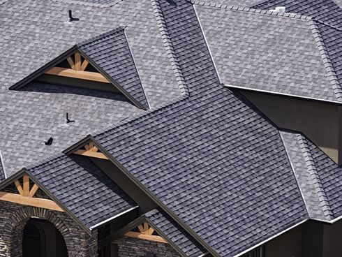 Rooftop in a newly constructed subdivision in Kelowna British Columbia Canada showing asphalt shingles