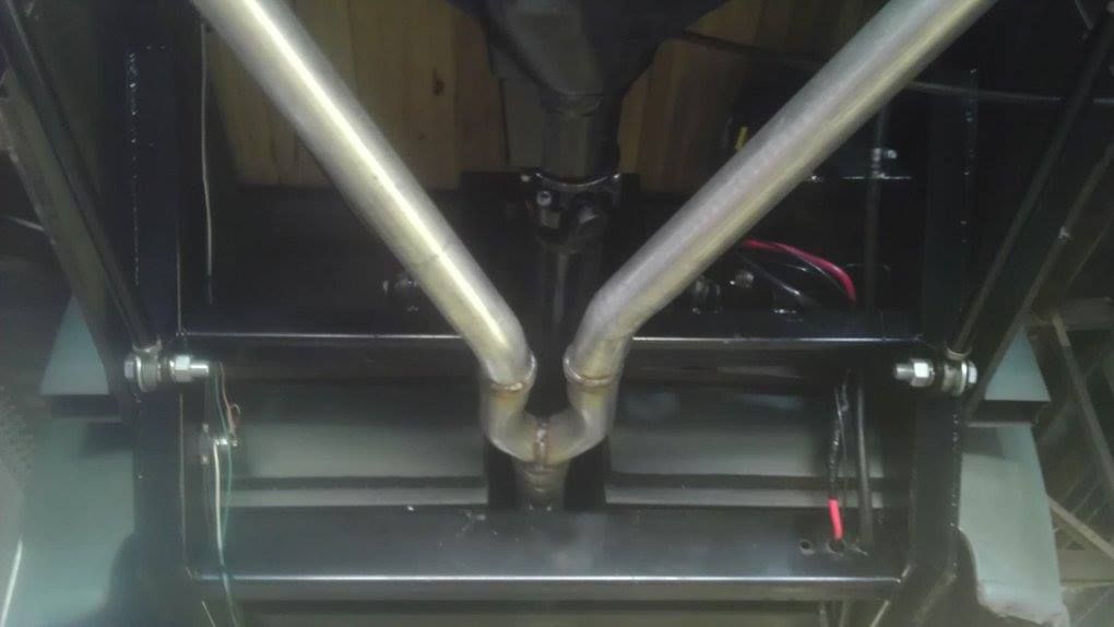 A close up of a metal pipe in a car.