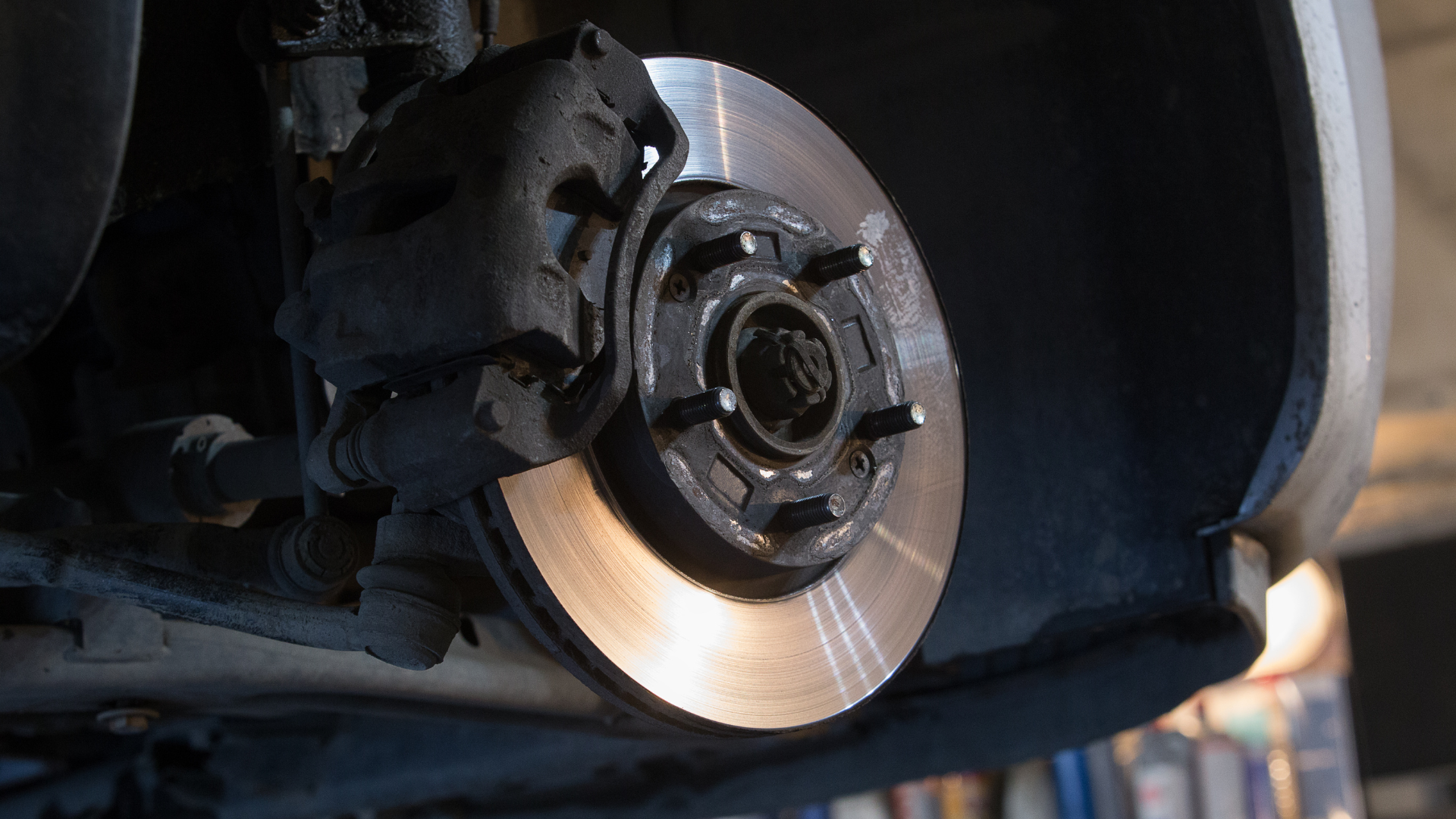 A close up of a brake disc on a car.